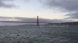 Boating Under the Golden Gate Bridge at Sun Down