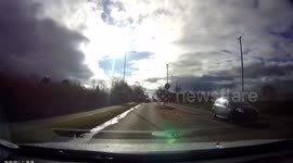Car crashes whilst protesters stage demonstration