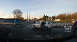 Car door swings open when motorist drives around roundabout