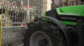 Greek farmers take the streets and block government building with tractors