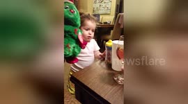 Girl, 2, 'serves' wine to her toys