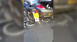Martin Clunes harangued by shopper for parking in motorcycle bay