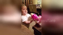 Girl, 2, 'serves' wine to her toys