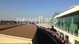 Passengers At Clapham Junction Basking In Sunshine