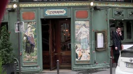 Christian Bale signing autographs outside Parisian restaurant
