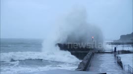 Massive storm waves at Mousehole cover building and car
