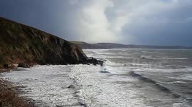 storms still hitting the south west coast from heavy foam and a funnel over plymouth
