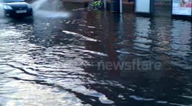 two cars drive through flood revealing burger king
