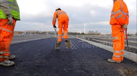 Construction Workers Having A Go At Shovel Walking
