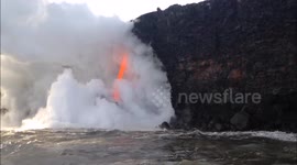 Incredible fire hose of lava flows from Kilauea volcano into the ocean