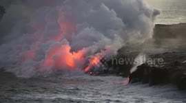 Lava sizzles as it meets ocean in Hawaii