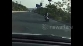 Motorcyclist trying to show off riding skills falls off bike