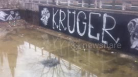 Street artist in an effort to revive the abandoned city pool