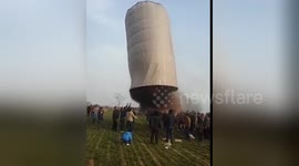 Villagers light giant home-made sky lantern