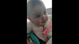 This baby doesn't quite like beans... but keeps eating