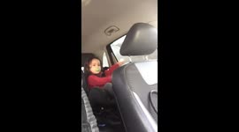 Newsflare - Toddler dancing in car seat. Newsflare - Toddler dancing in car seat.