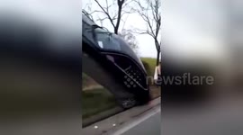 Car drives into advertising pole in China