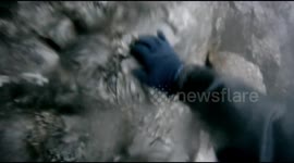Foolishly free climbing down a wet cliff face on Crib Goch