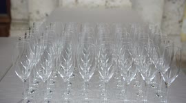 Catering preparation before the wedding, putting down flutes for  the welcome drink, 4K