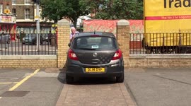 Driver tries to squeeze car through extremely tight gap