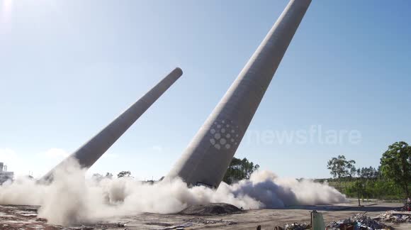 Two giant power station chimneys demolished in controlled explosion ...