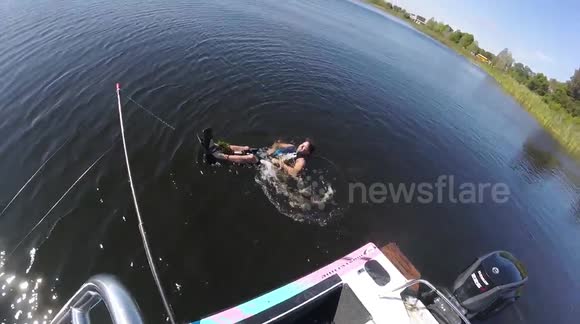 Man water skis on keyboards