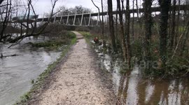 Flooded walkpath beside river in Limerick