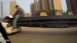Man rides 20-metre-long plastic pipes poking out of car
