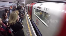 Commuters packed together on the London underground.