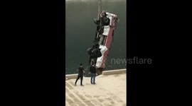13 killed after coach plunges into river in China