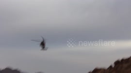 driving under a landing helicopter