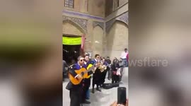 Espagnol tourist music play guitar in Esfahan, Iran 2017
