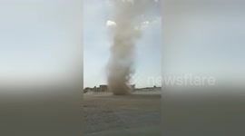 Dust devil rips through school playground