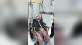 Newsflare Edit - 109 year old grandma doing exercise to keep fit with the help of her son