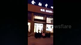 Over a dozen of workers kneel down to read ‘The Scroll Marked’