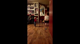 Sister doing whatever she can to make Brother laugh