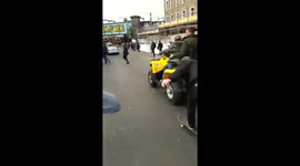 Person falls of skateboard after hiking a ride with quad
