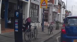 Woman takes a tumble at side of road