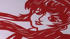 Elderly man paper cutting characters in computer games