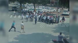 Good Samaritans lift two-ton vehicle up to rescue trapped driver