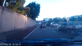 Driver nearly crashes into me on lane change. Illegal undertake.