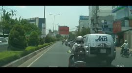 Stealing valuables on the street in Saigon , Vietnam
