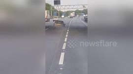 Newsflare Edit - ous driver without  tire on  M25