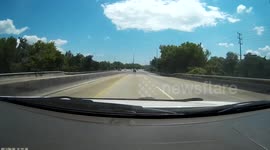 Person stops car in left lane of highway to do a u-turn