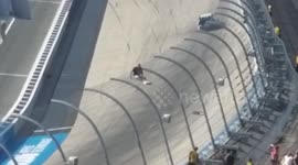 Man apprehended after climbing onto security fence at NASCAR race