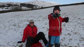 Family Fun Sledging in the Snow