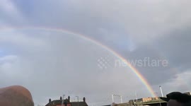 Jeremy Corbyn speaking at the end of a rainbow in Birmingham