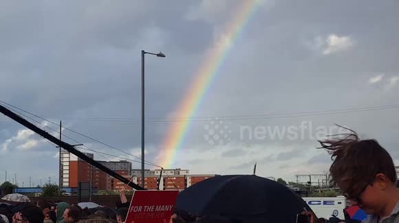 Rainbow appears next to Jeremy Corbyn as he delivers speech