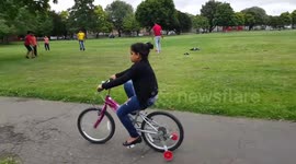 Football playing Southall park UK