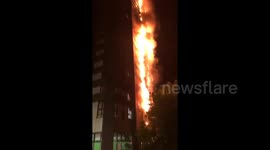 Debris falling from ablaze Grenfell Tower in West London
